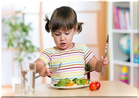 girl eating vegetables