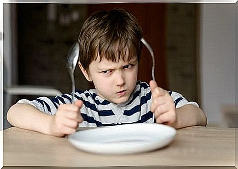 boy with spoon and fork