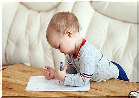 baby writing on paper