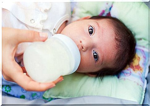 baby drinking milk from the bottle