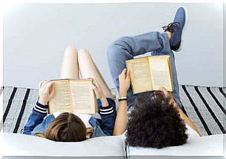 father and daughter reading books