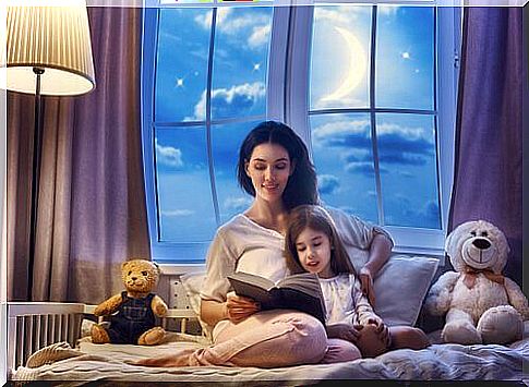 Woman reading a bedtime story to a girl